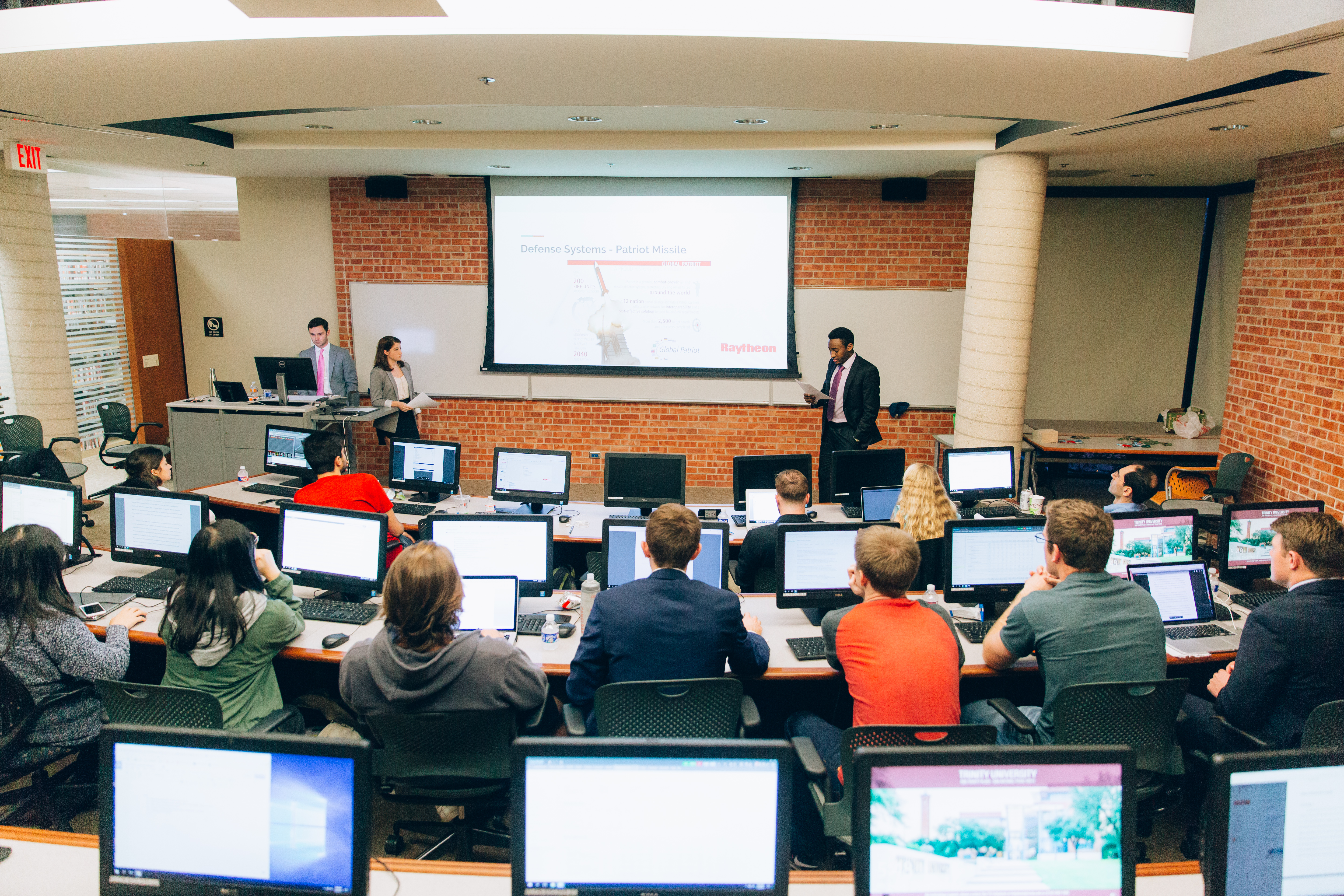 Back of the classroom view looking at professor giving lecture