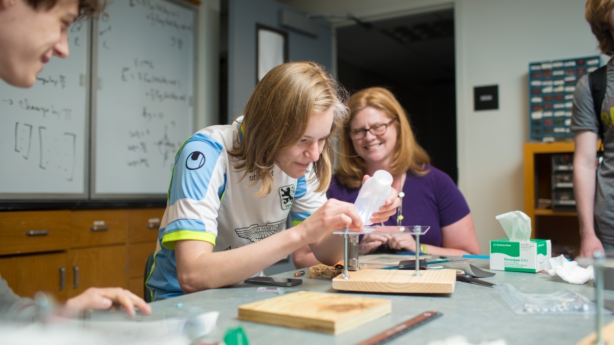 Students in classroom building a small structure 