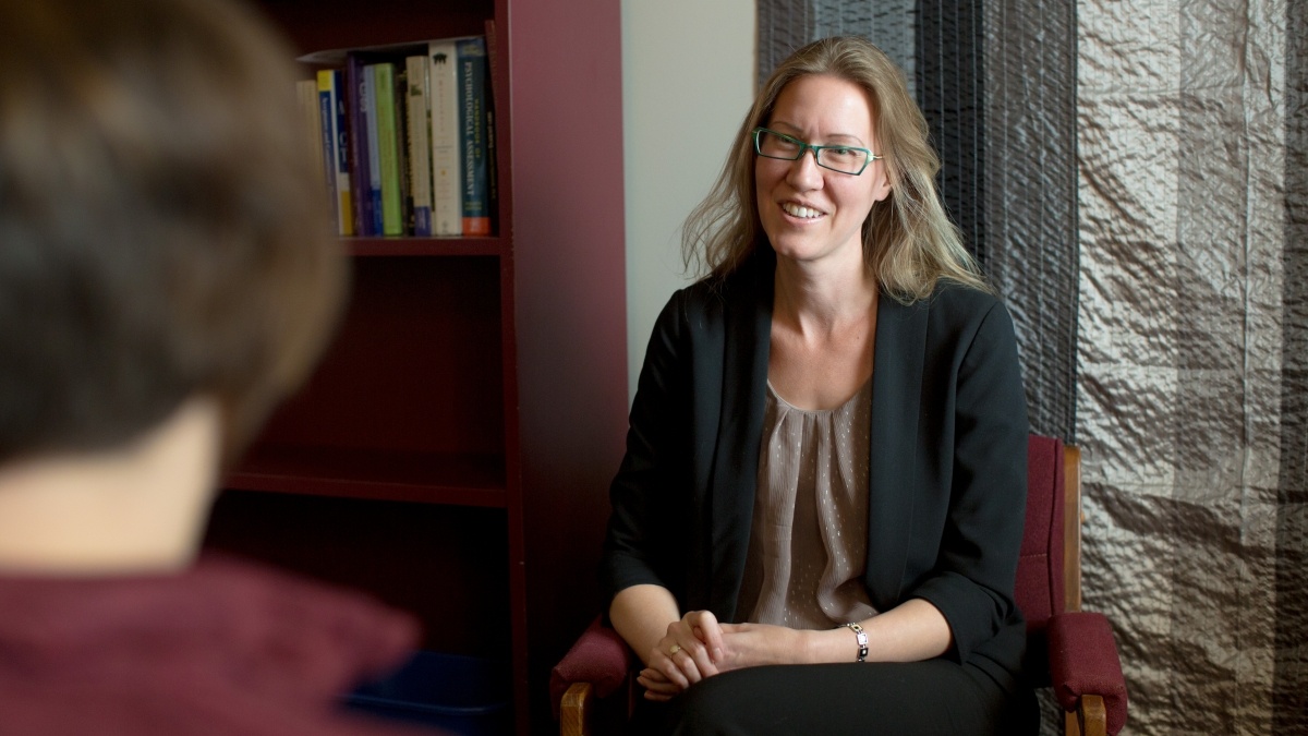 Professor talking to student while both are seated