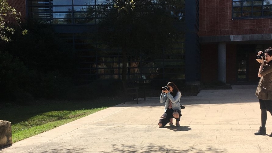 Students take photos around the Trinity campus