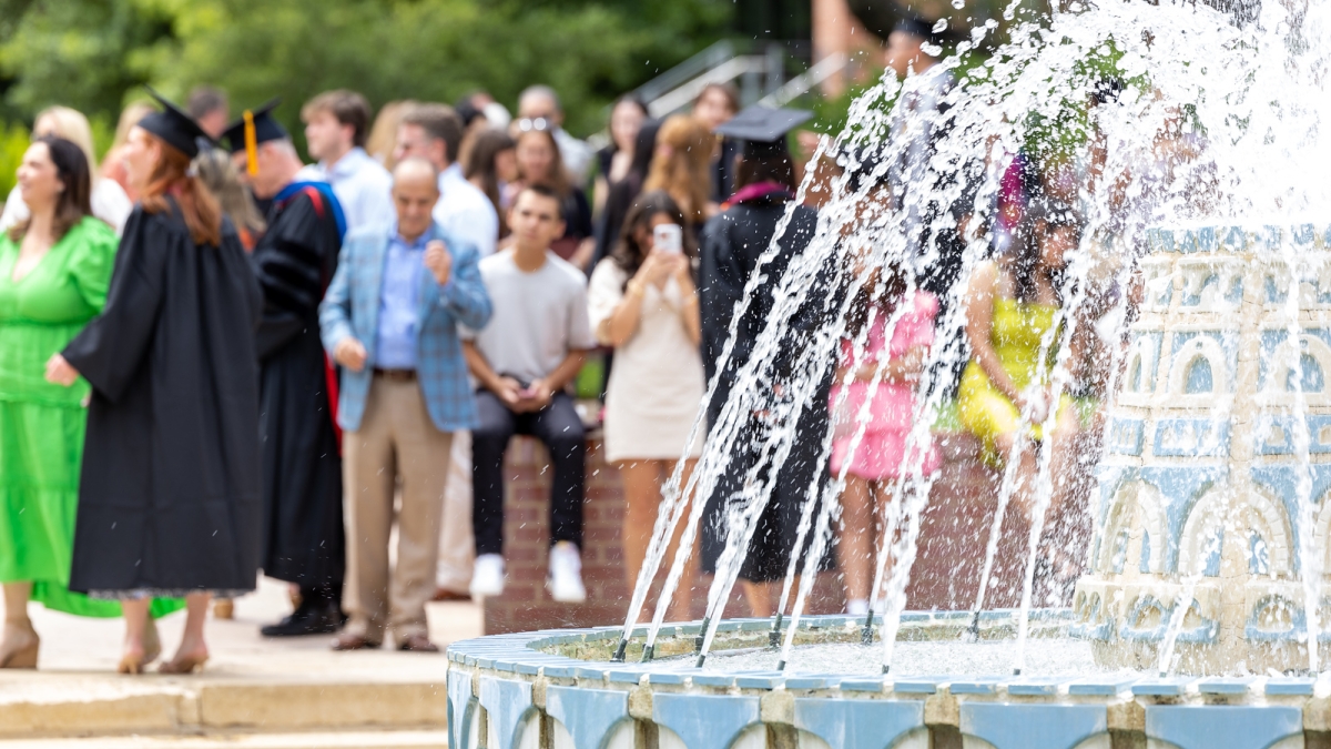 Students and families around miller fountain for commencement
